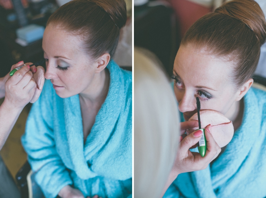 Katie having her makeup done on her wedding day
